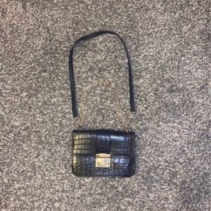 Black adjustable crossbody animal print bag